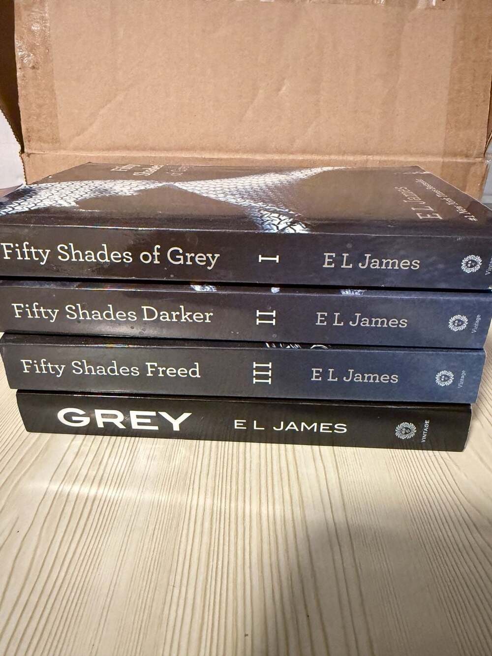 Fifty Shades Trilogy and Grey 4-Book Set by E.L. James Paperback